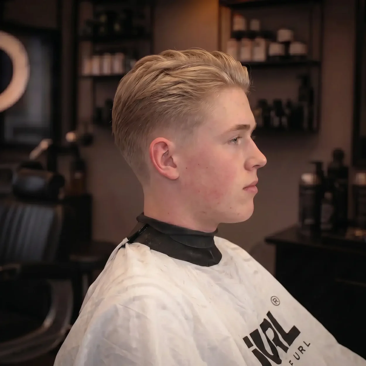 mand med low taper fade slickback